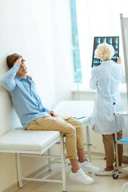 istock Young man dissapointed by his x-ray analysis 938708644