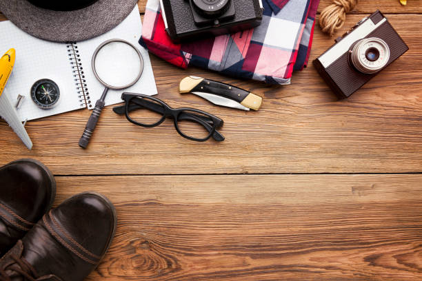 istock Travel accessories top view on wooden background 938716334