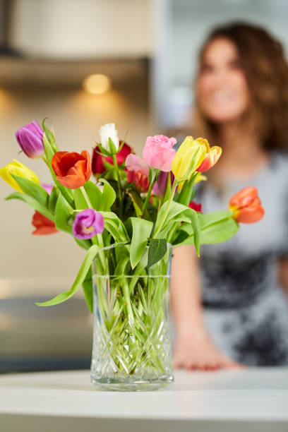 istock Tulips with woman in background 938720980