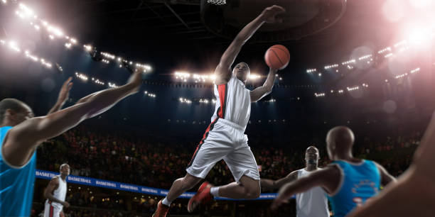 istock Mid Air Pro Basketball Player About To Score With Dunk 938727550