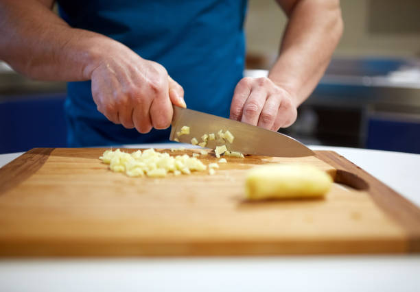 istock Man cooking at home 938727584
