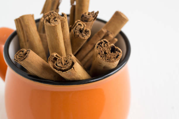 Fragrant sticks of Ceylon cinnamon on white background.