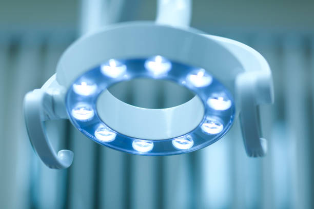 Great lamp for the operating room. Modern dental lamp in dental clinic. Close up on an overhead dental or medical exam light, with selective focus on LEDs of lamp. New technology in modern clinic. stock photo