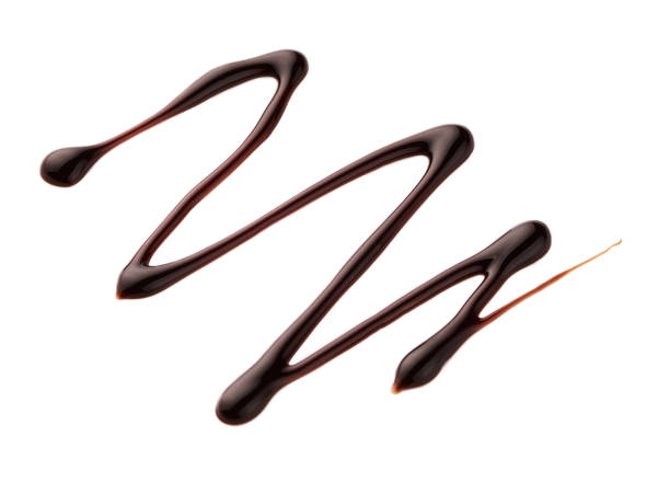 istock Chocolate sauce. Hot sweet liquid. Wave isolated on white background. 938728760