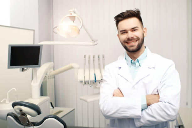 istock A young cheerfull male dentist in the dentist office 938732686