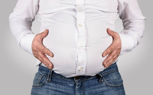 istock Over weight -  Fat man shows his belly 938732716