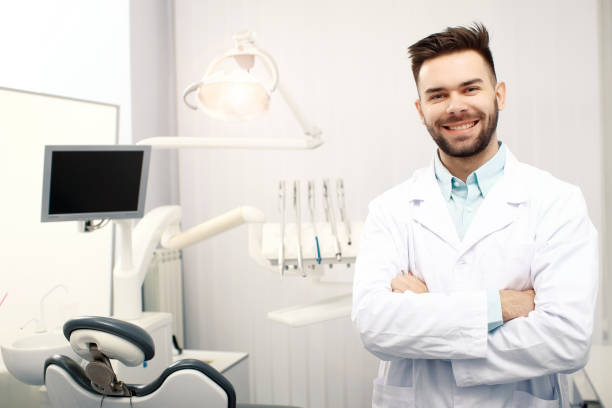 istock A young cheerfull male dentist in the dentist office 938732732