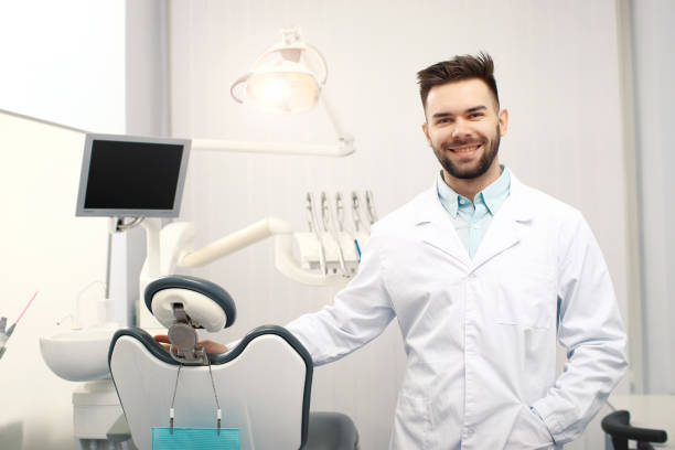 istock A young cheerfull male dentist in the dentist office 938732836