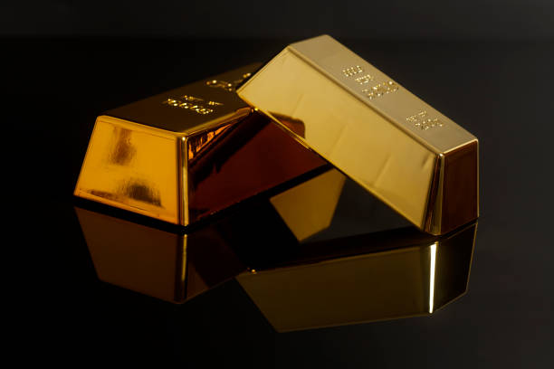 istock Gold bullion on black background 938732934