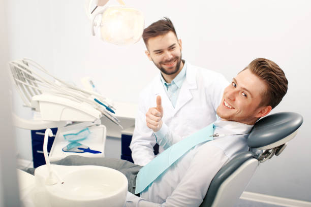 istock A young man at the dentist office 938733398