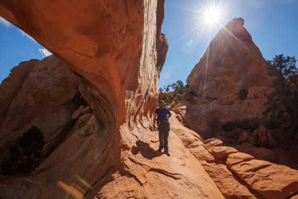 istock Hiker rests in Arches National park in Utah, USA 938743314
