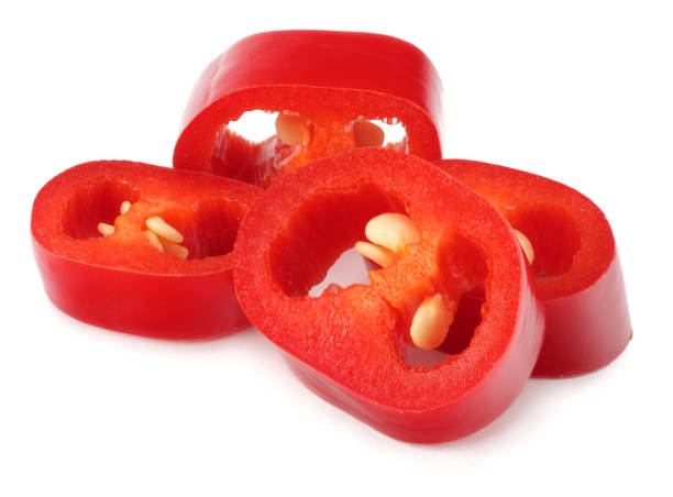 istock sliced red hot chili peppers isolated on white background 938744410