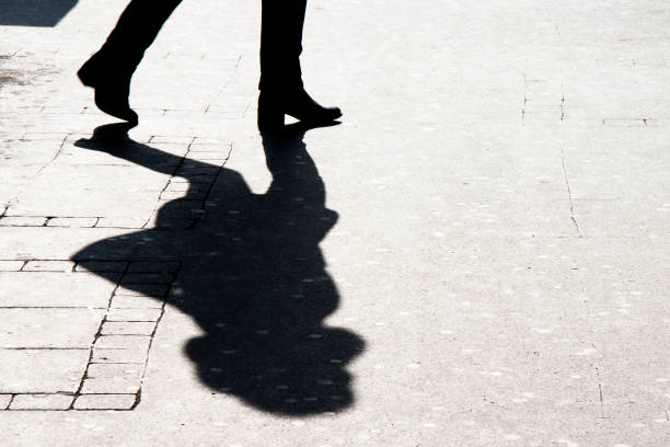 istock Silhouette shadow of woman walking 938747996
