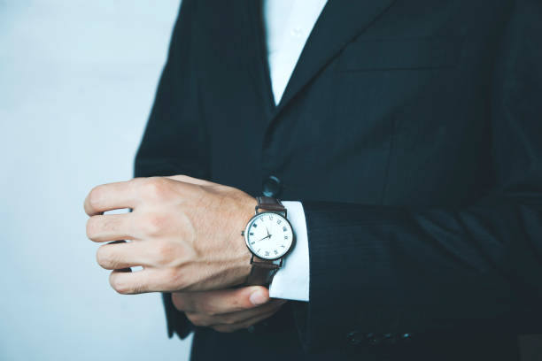 istock Businessman checking time from watch 938753288