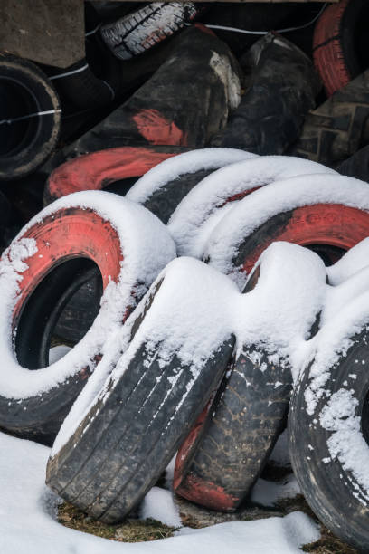 Karpacz: Bundle of disused tyres in a snow in an old garage storage