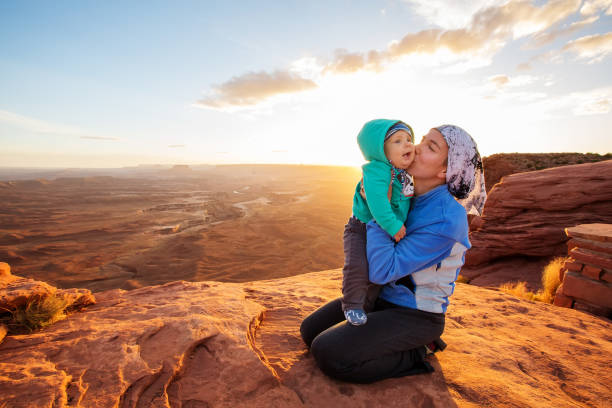 A mother and her baby son visit Canyonlands National park in Utah, USA A mother and her baby son visit Canyonlands National park in Utah, USA mesa photos stock pictures, royalty-free photos & images