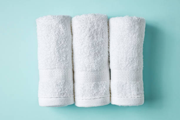 istock White spa towels on blue, from above 938759344