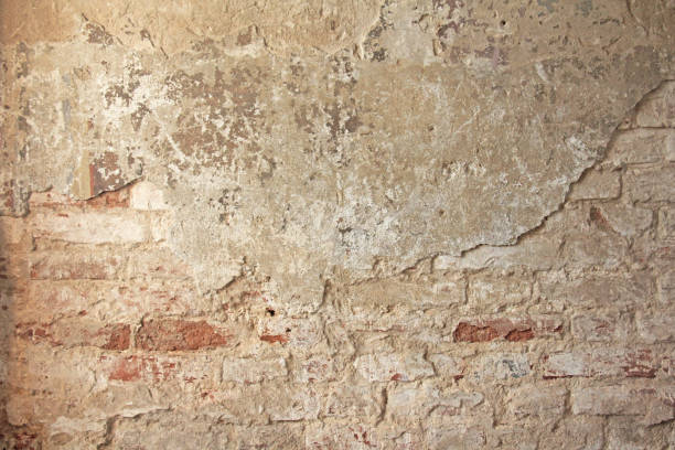 istock Red, Terracotta and White Brick Background. Old Wall of Red Bricks and White Brayed and Cracked Old Paint. 938764098