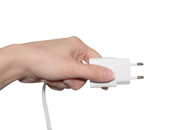 istock plug the charge in hand on a white isolated background 938764480