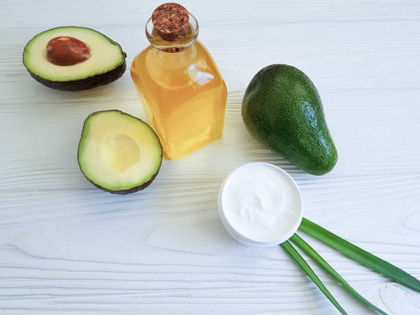 istock cream avocado oil on white wooden 938770220
