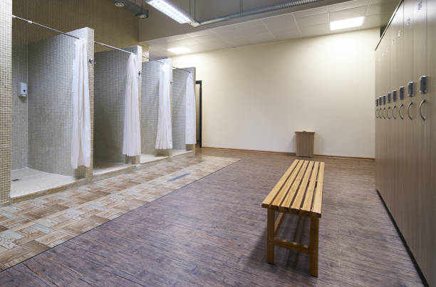 istock Public shower interior with everal showers 938771772