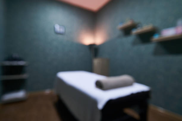 Blurred Interior of massage room in a spa salon Blurred Interior of massage room in a spa salon. Place for relaxation in modern wellness center spa room stock pictures, royalty-free photos & images