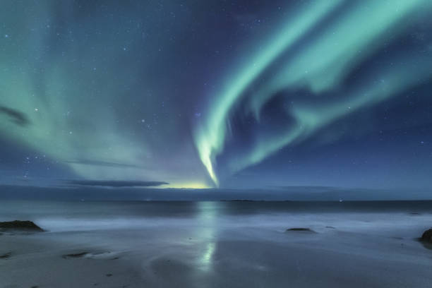 istock Northen light under mountains. Beautiful natural landscape in the Norway 938772434