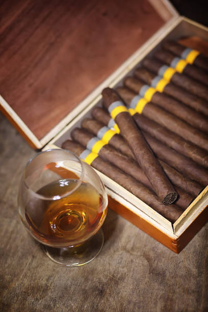 istock Large box of Cuban cigars on a wooden table 938785408