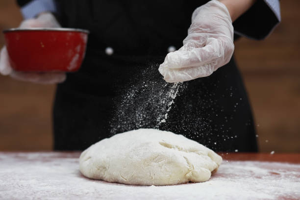 istock the cook makes flour for baking on the table 938786444