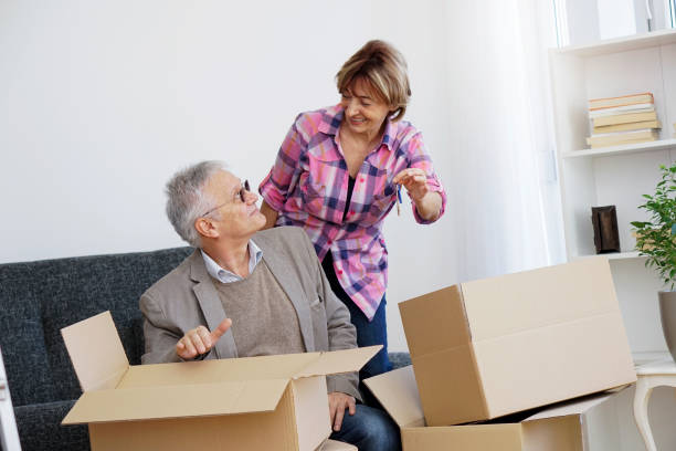 istock Senior couple moving into a new apartment 938788782