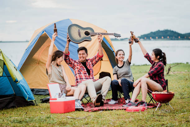 istock Asian friends having a good time together while travel camping 938817434