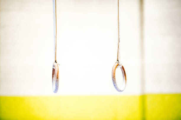Gymnastic rings to strengthen the arms on street sport ground. Outdoor sports field. Healthy lifestyle. Close up.