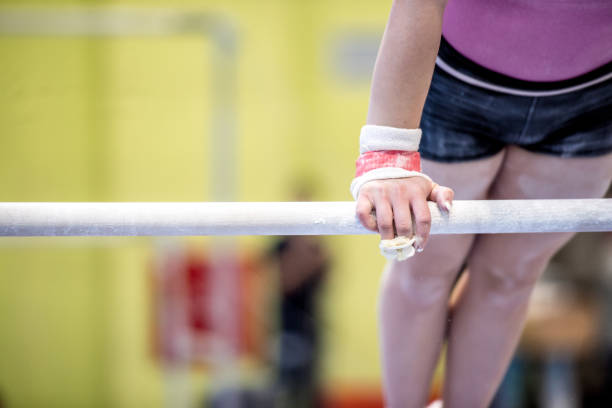 istock Young Woman Athlete Exercising on Horizontal Bar 938817860