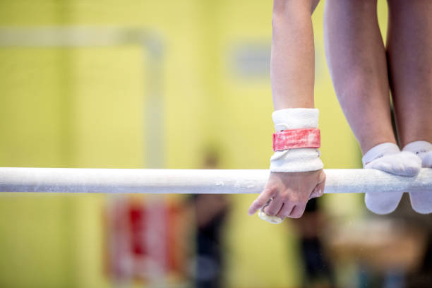 istock Young Woman Athlete Exercising on Horizontal Bar 938817876