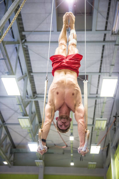 istock Young Gymnastics Athlete Exercising on Rings 938817920