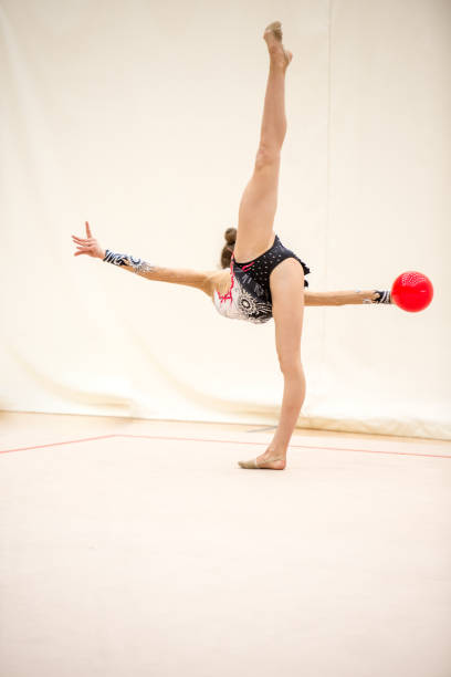istock Portrait of Young Rhythmic Gymnastics Athlete Practicing With Ball 938818276