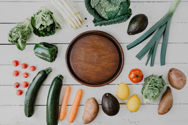 istock Layout of vegetables on white wood 938822956