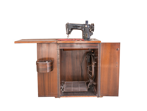 Ancient sewing machine, isolated on white background with clipping path
