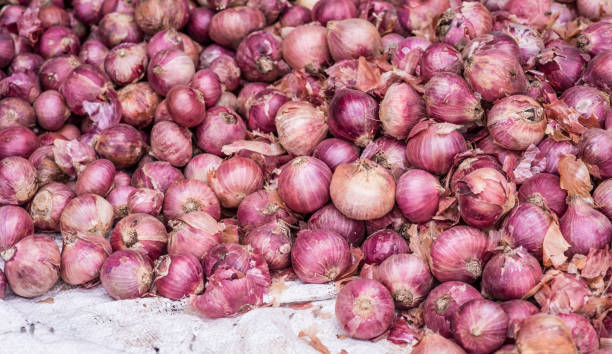 istock Bulk red onions from a street market 938827634