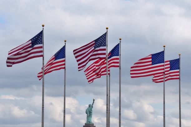 istock American Flag Against Statue Of Liberty 938828066