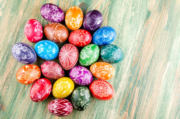 istock colorful scratched handmade Easter eggs on a wooden table 938839510