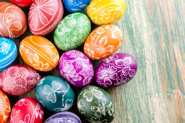 istock colorful scratched handmade Easter eggs on a wooden table 938839512