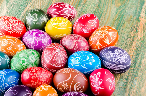 istock colorful scratched handmade Easter eggs on a wooden table 938839514