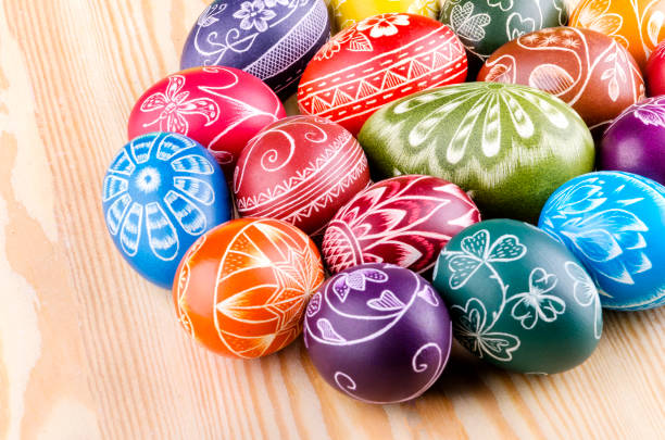 istock colorful scratched handmade Easter eggs on a wooden table 938839560