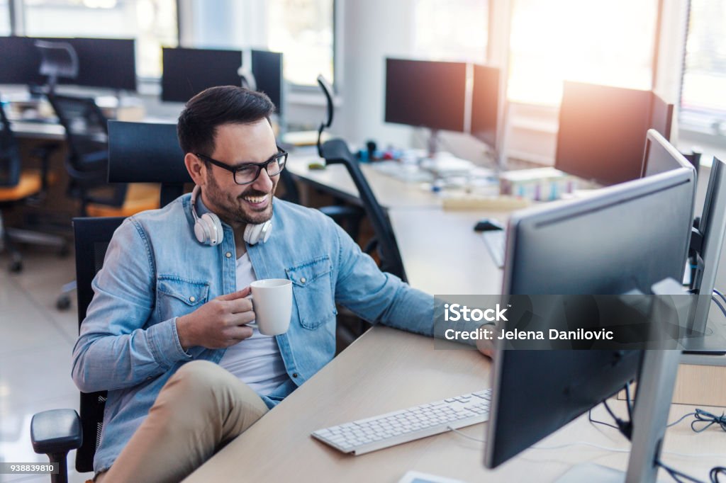 Relax Programmer Programmer On His Workplace Stock Photo - Download Image Now - Casual ...