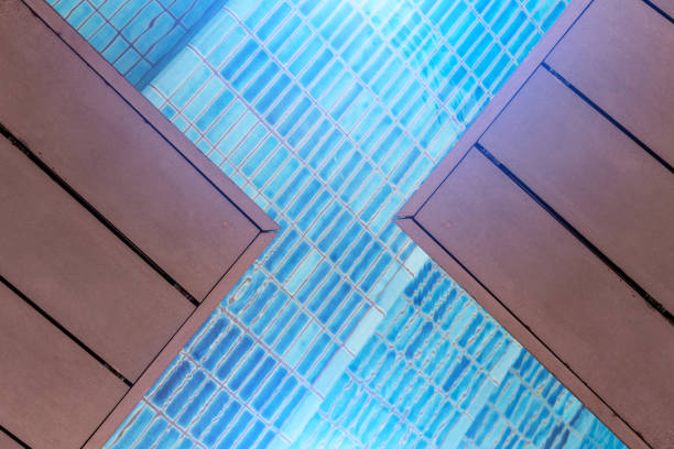 istock swimming pool with blue mosaic with stair step view from top 938848652
