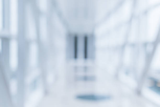 istock blur image background of white spce public corridor 938848672