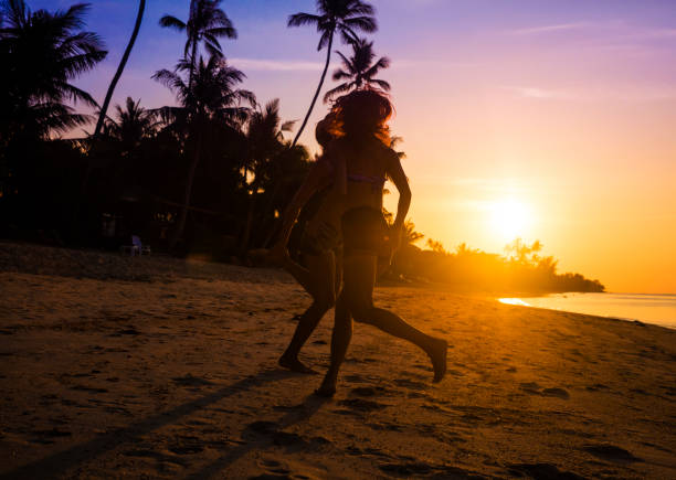 istock friends dancing on a sunset beach 938848834