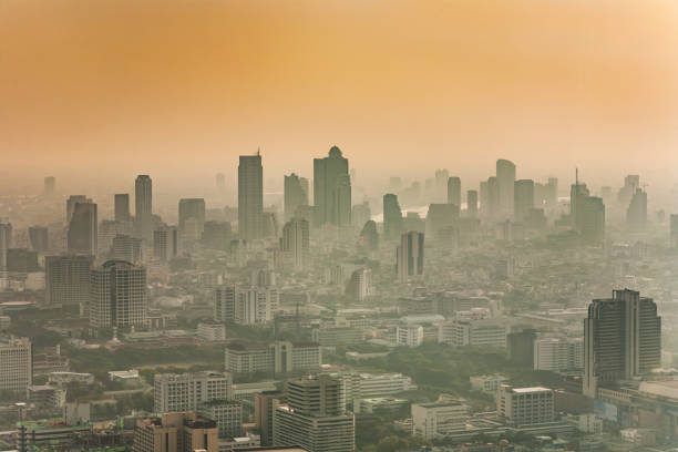 Bangkok skyline in smog during sunset stock photo