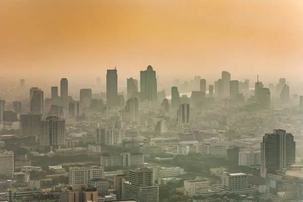 Bangkok skyline in smog during sunset, Thailand